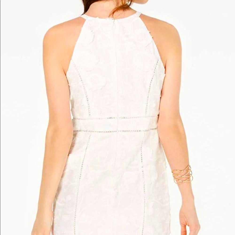 white dress, ruffles in the end, long zip in the back